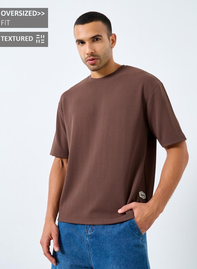 Styli Men Oversized Textured Badge Detail T-Shirt - Image 1